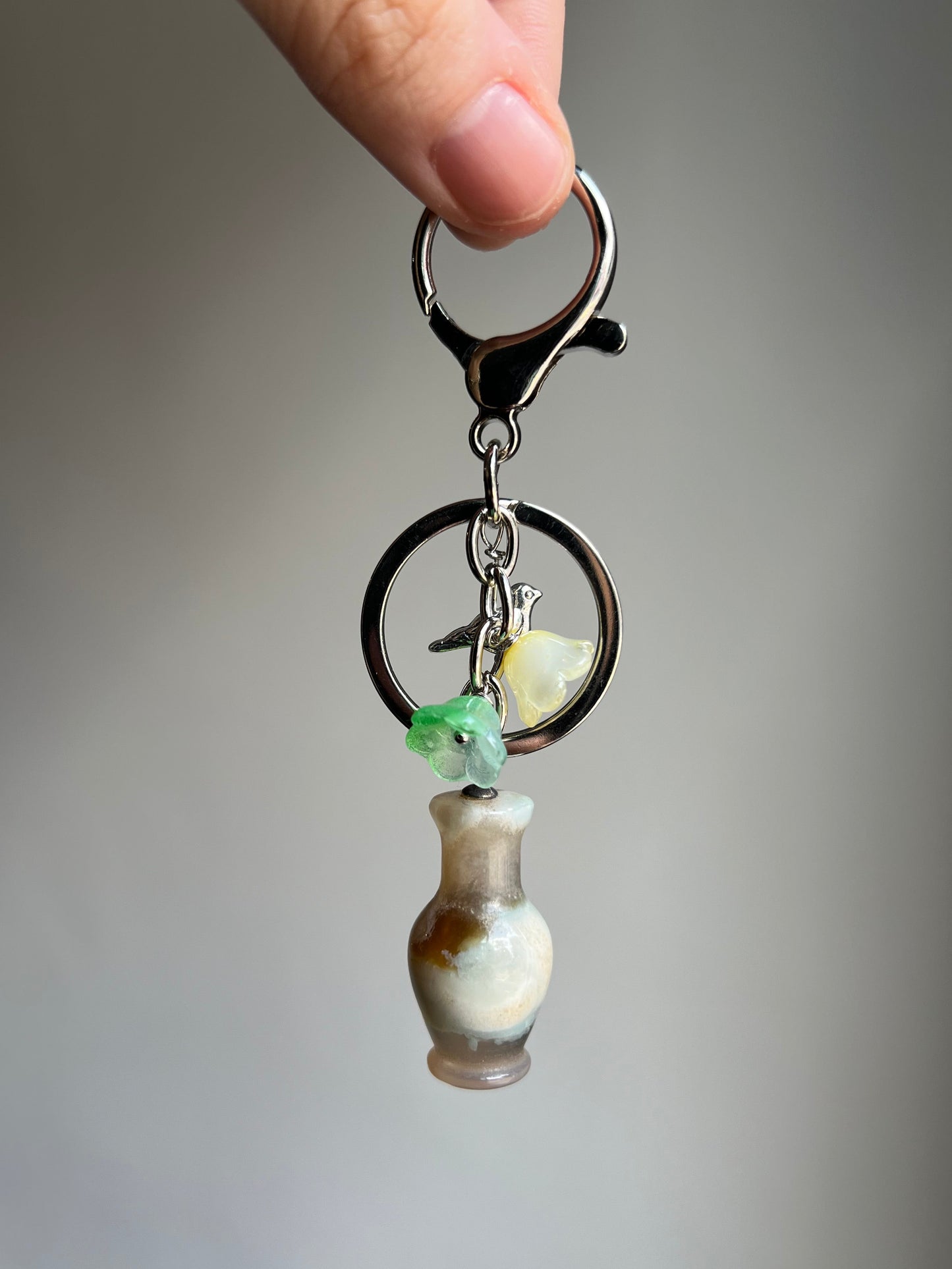"new beginnings" flower agate vase bag charm